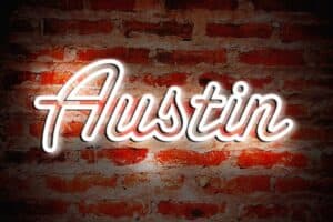 neon sign promotes dining in Austin Texas