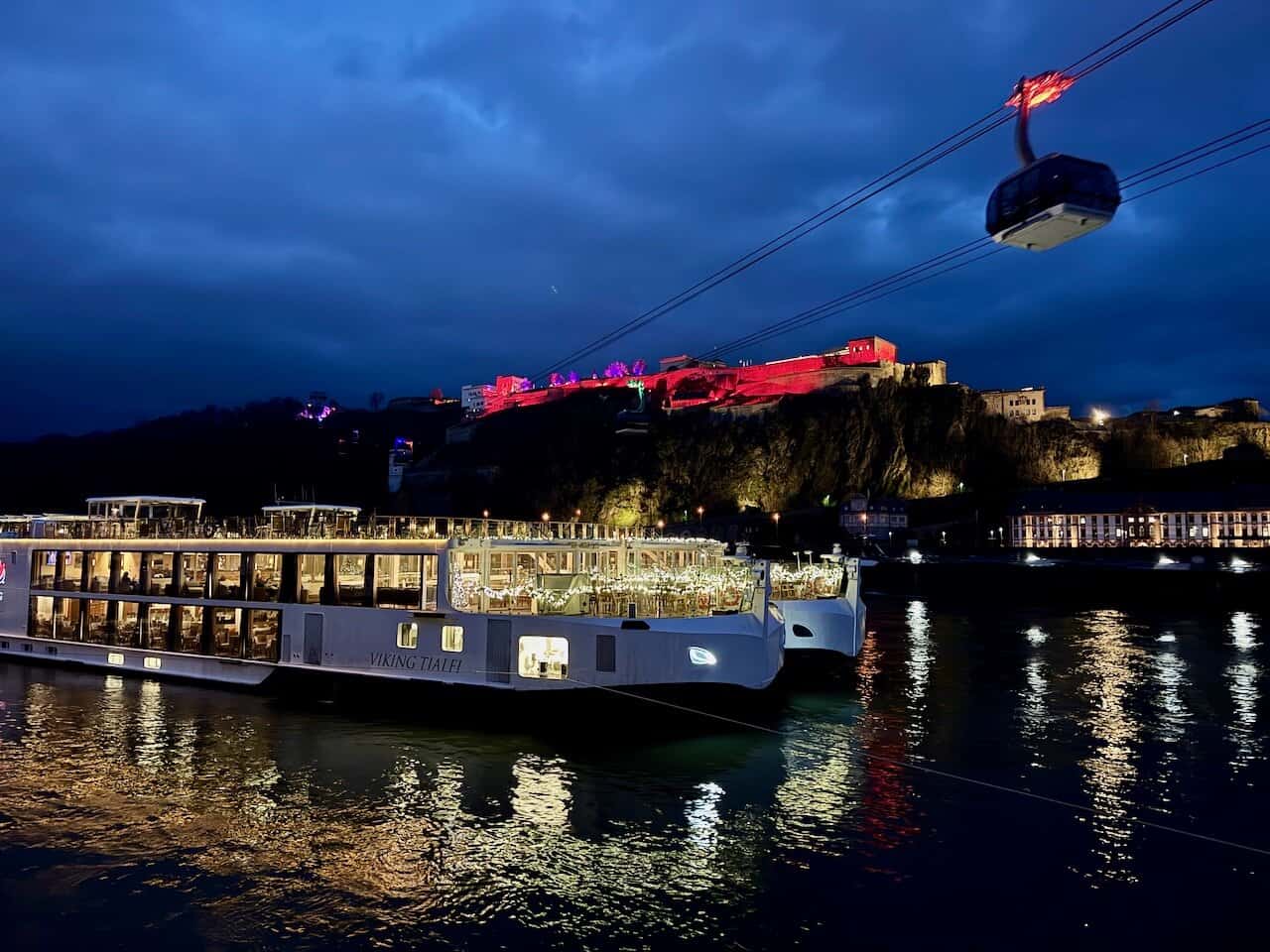 The Viking Tialfi river cruise ship in Koblenz, Germany with Ehrenbreitstein Fortress in the background and a cable car above.