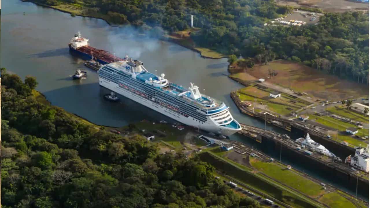 Aerial view of a cruise ship traveling through the Panama Canal