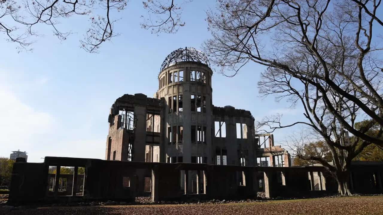 Atomic Bomb Dome in Hiroshima, Japan with trees and sky