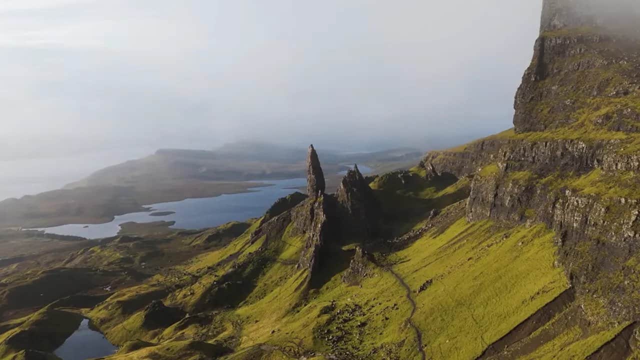 Misty view of Isle of Skye cliffs overlooking lochs and ocean